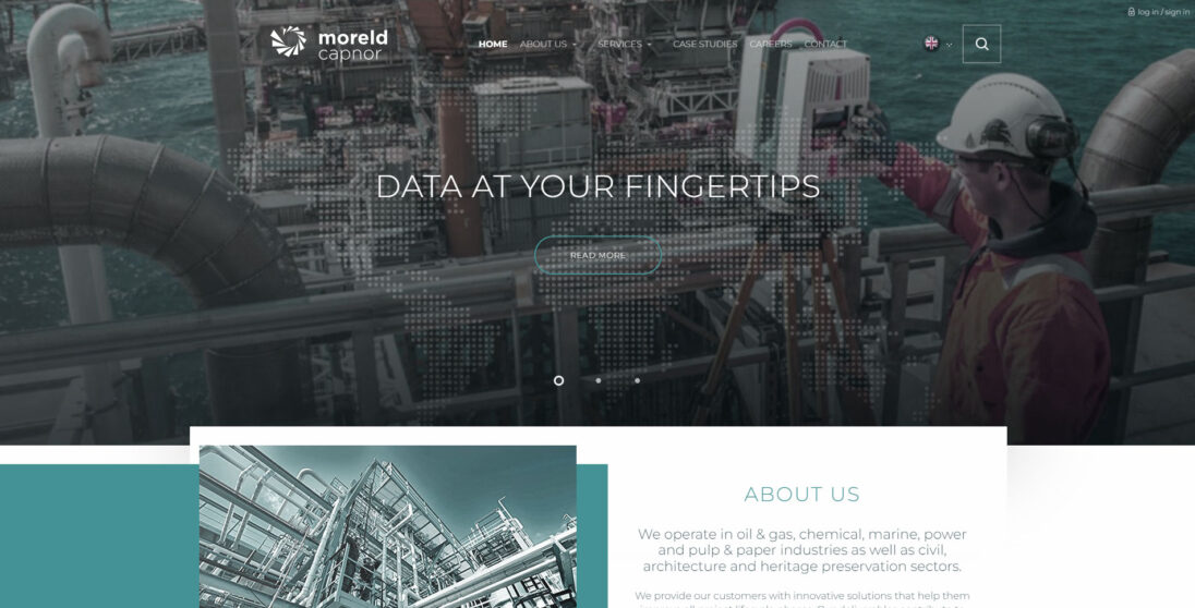 Image of a professional working on an offshore oil and gas platform, showcasing industrial equipment and marine environment. The website design emphasizes data accessibility and services in various sectors including oil, gas, chemical, and marine industries.